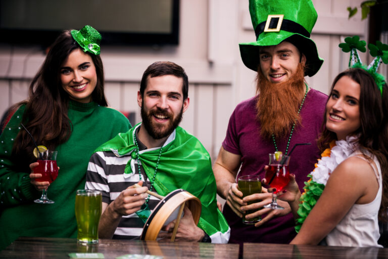 Friends celebrating St Patricks day with drinks in a bar